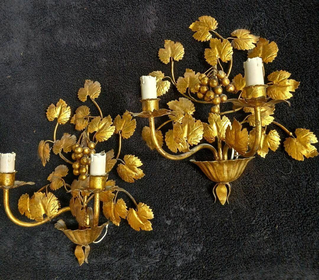 Stunning vintage wall lights in gilded iron with vine and grape decor from Italy.