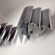 Pair of Raak wall lamps, space-age chrome design, Germany, 1970