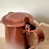 Old pitcher in brown enamelled sheet metal, spout and lid
