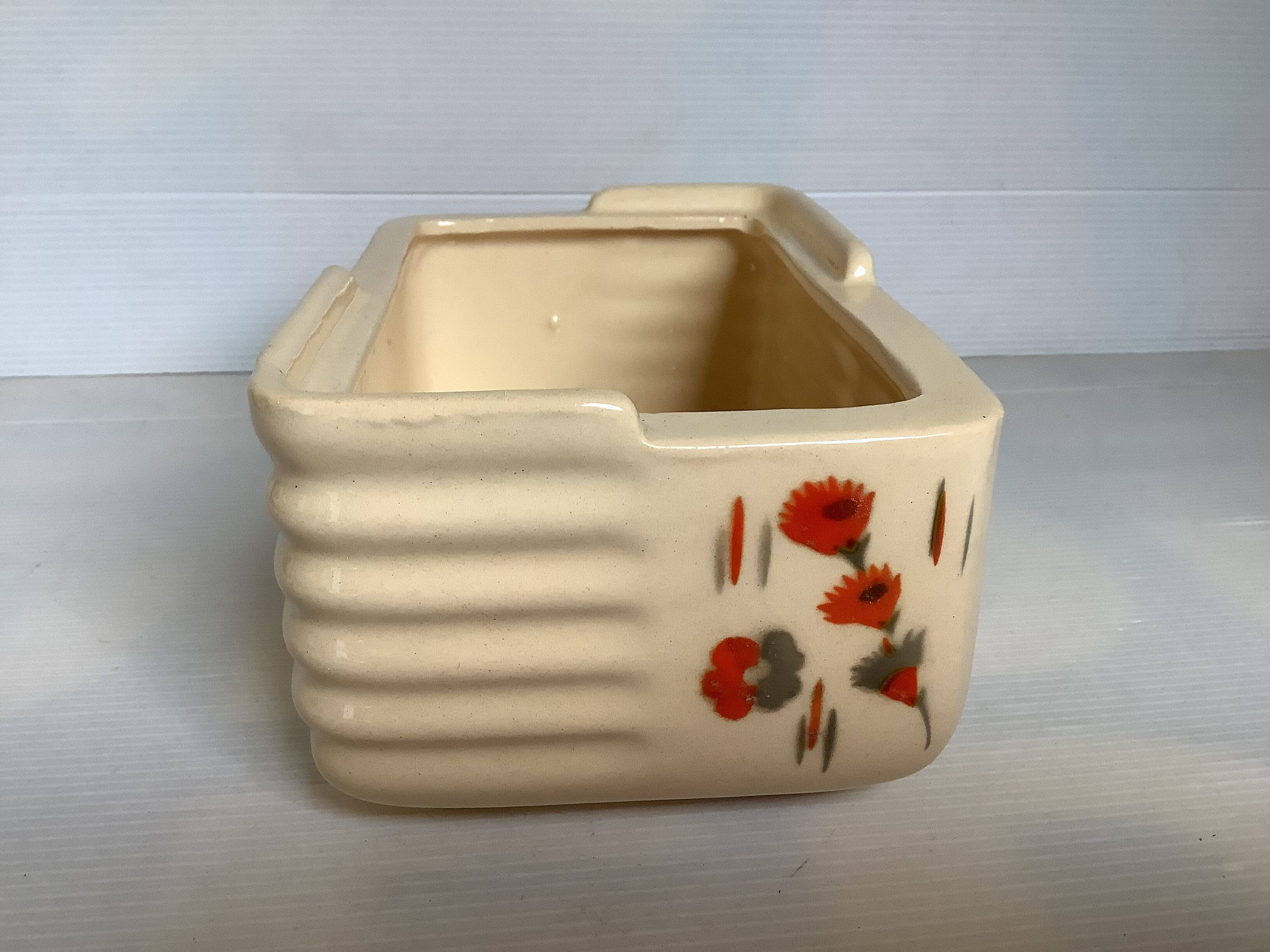 Art Deco planter with stencilled flower motif