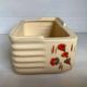 Art Deco planter with stencilled flower motif