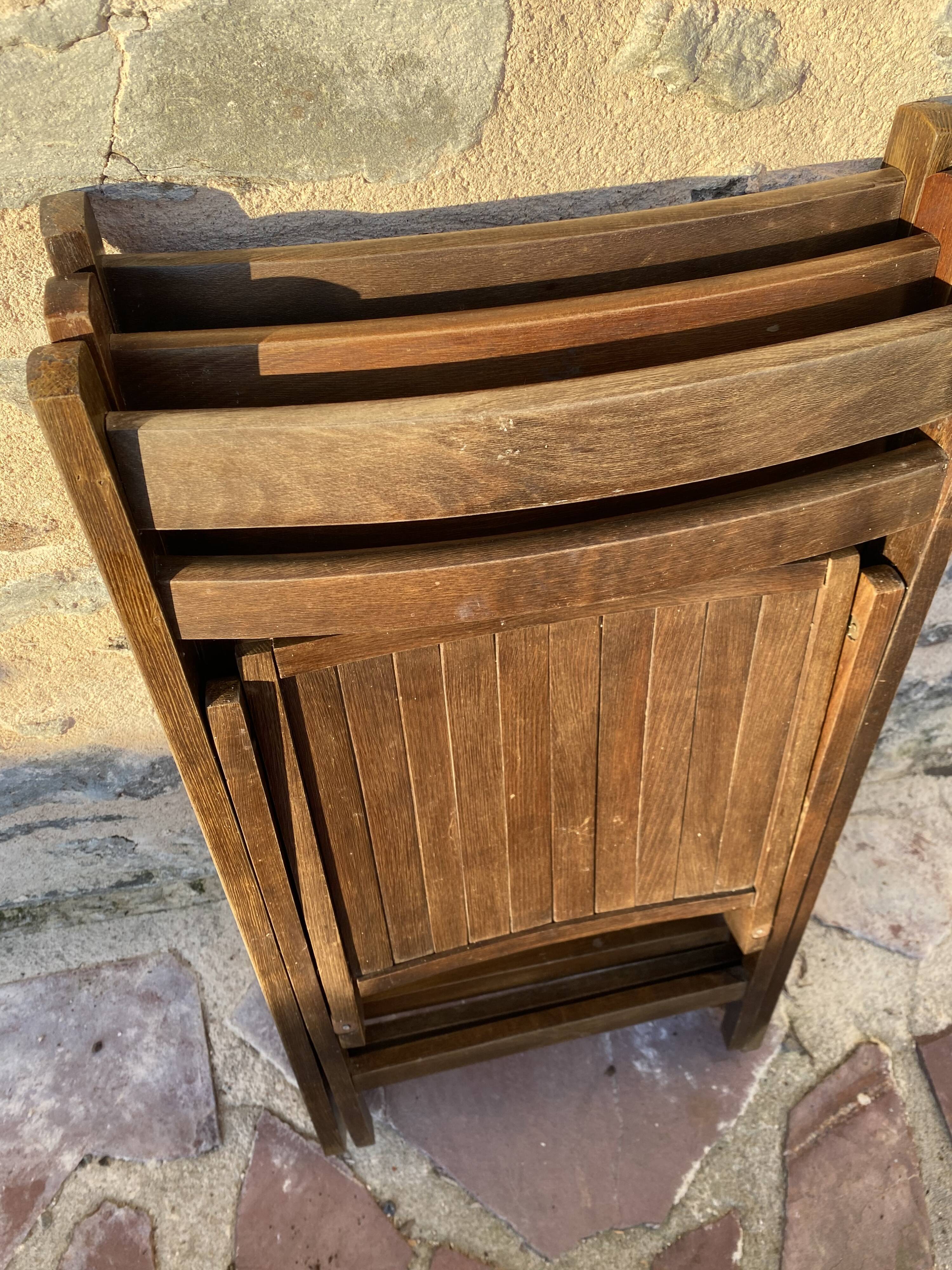 Three wooden folding chairs