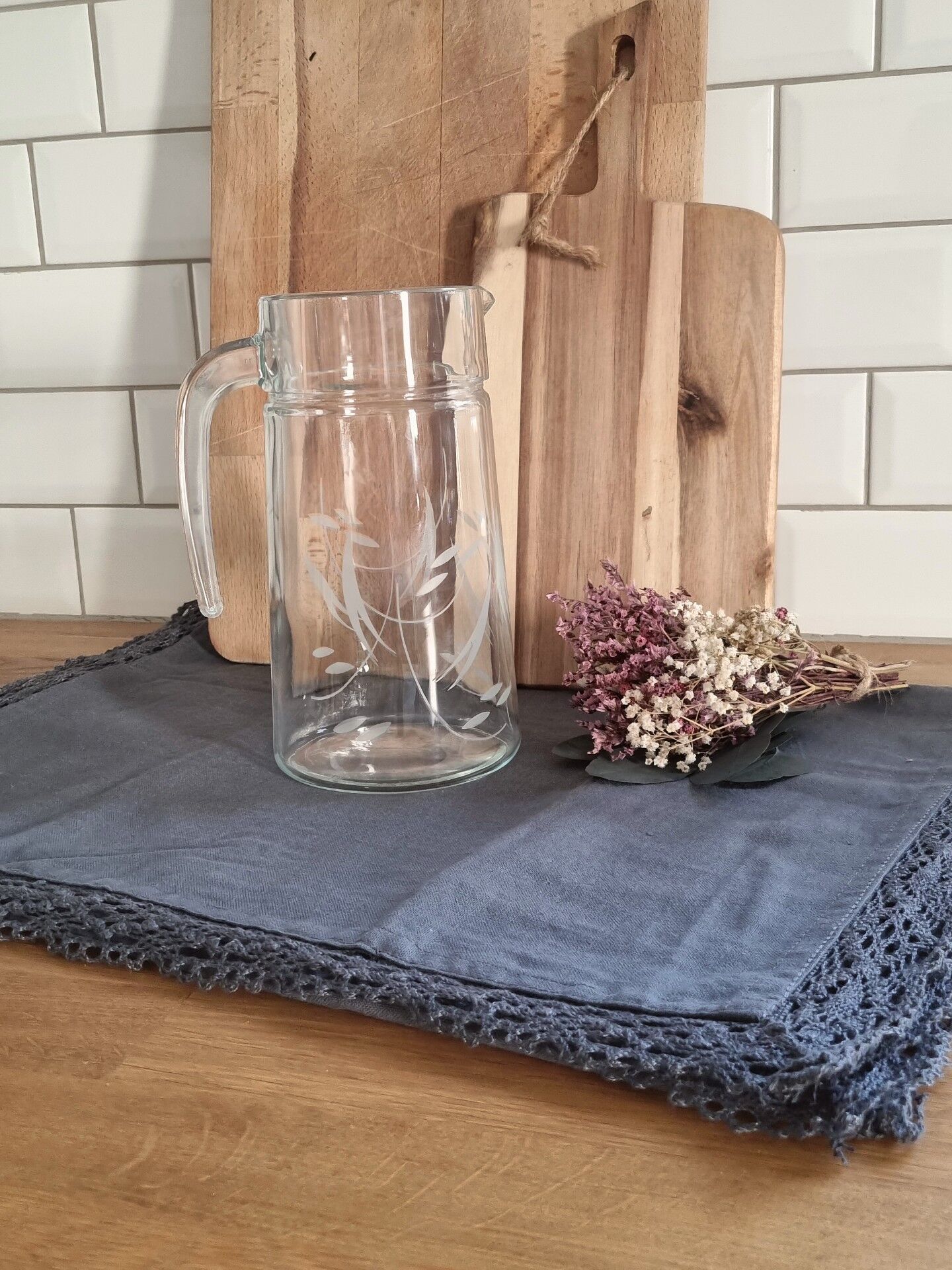 Engraved glass pitcher