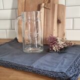 Engraved glass pitcher