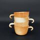 4 cups in glazed stoneware with graphic handles