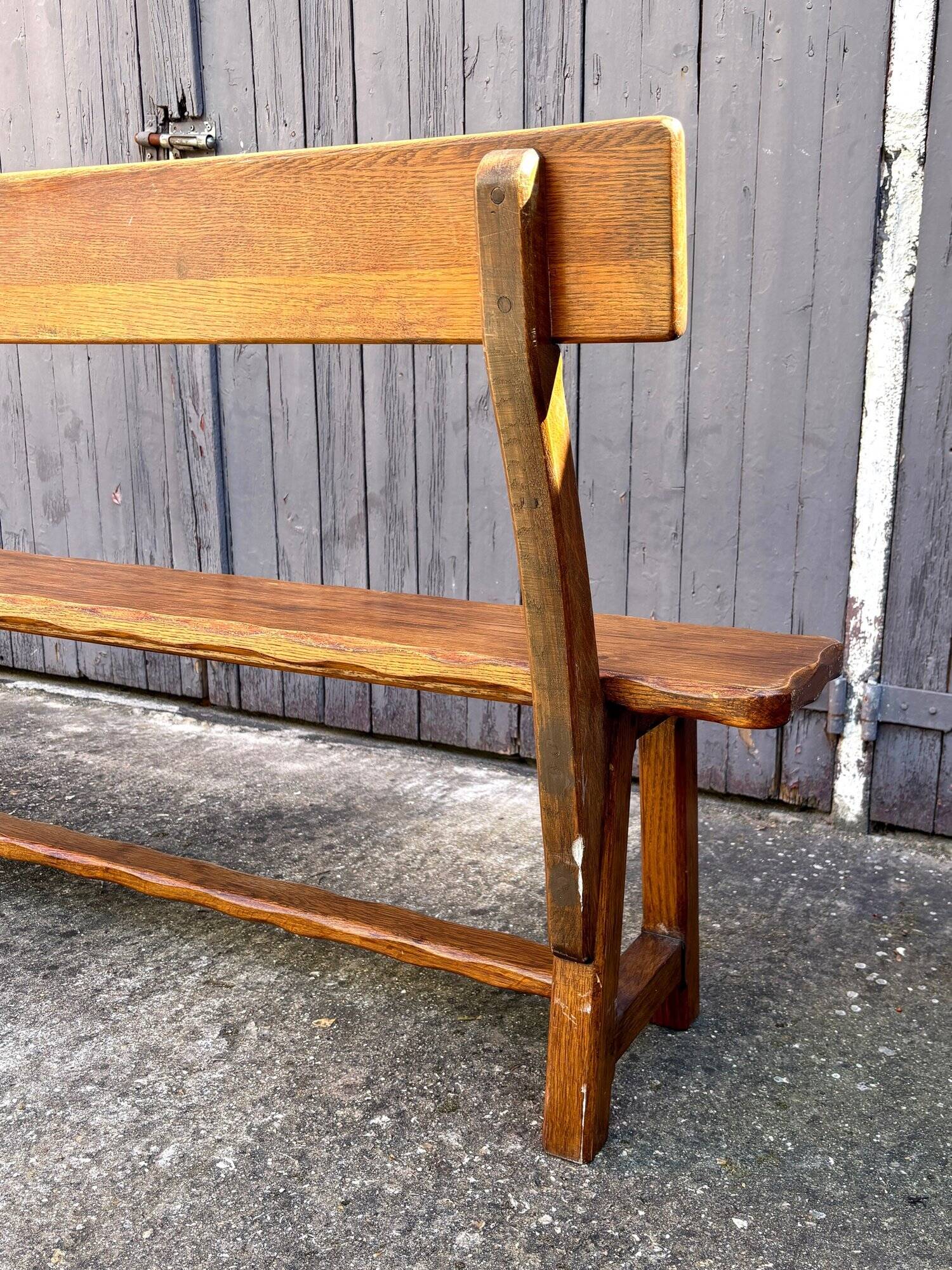Brutalist bench with dark wood back