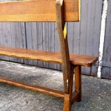 Brutalist bench with dark wood backrest