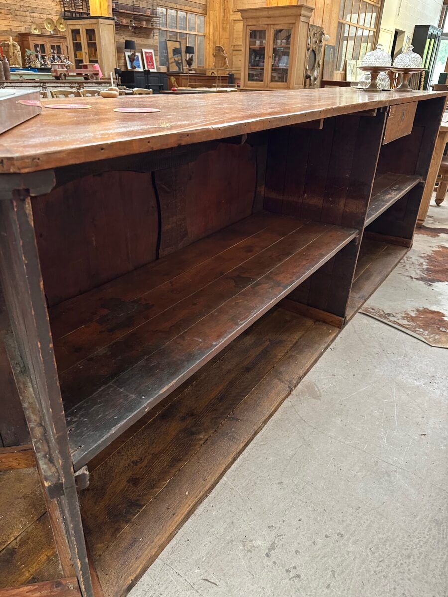 Large corner bar counter from the late 19th century.