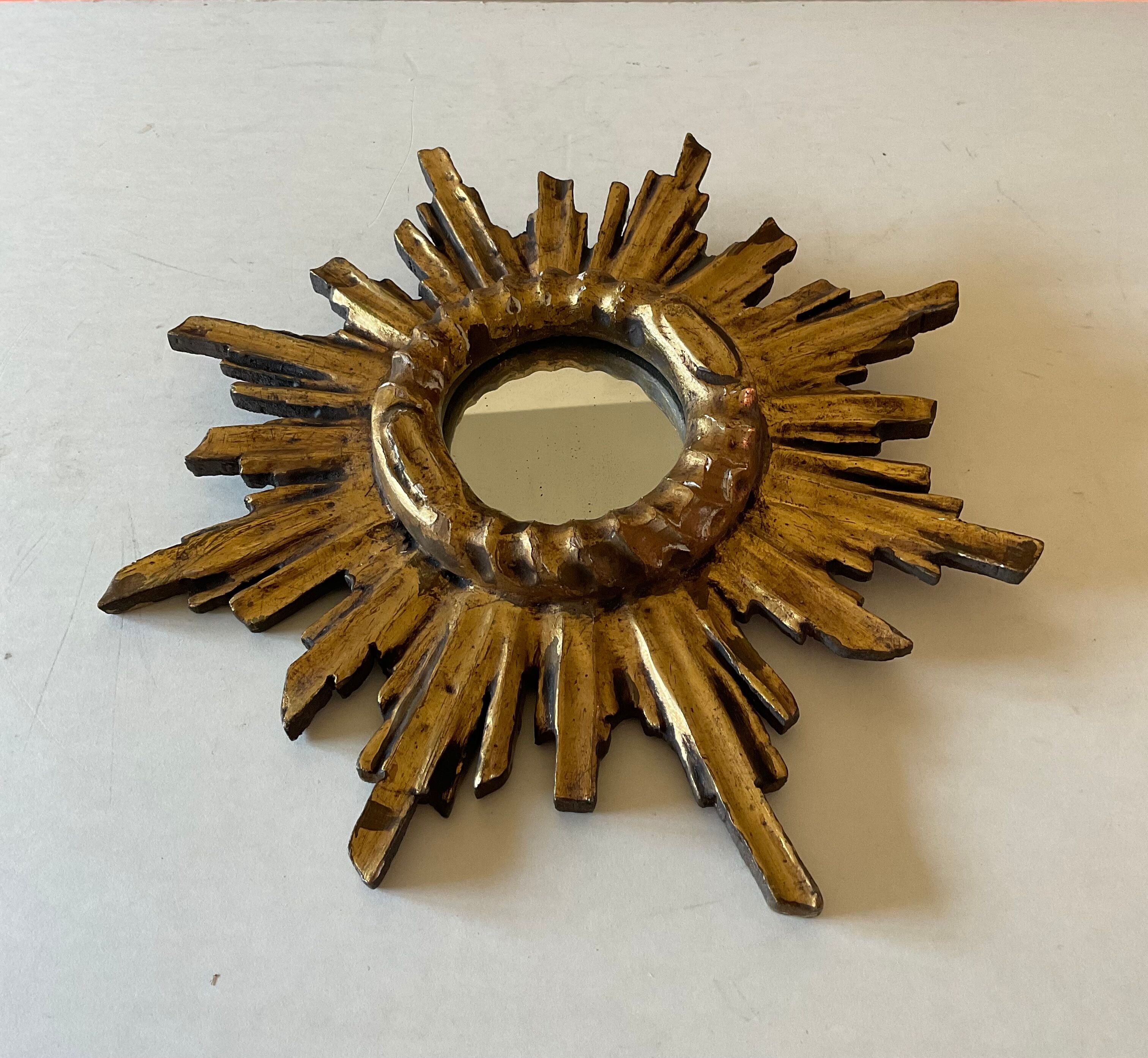 Miroir soleil vintage en bois doré