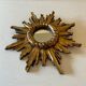 Miroir soleil vintage en bois doré