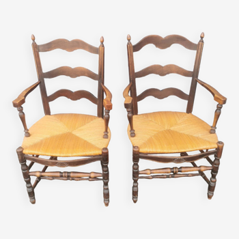 Pair of blackened wooden armchairs