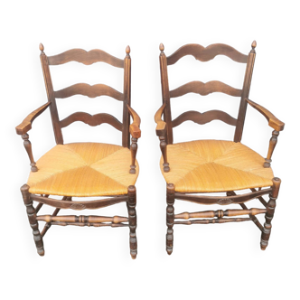 Pair of blackened wooden armchairs
