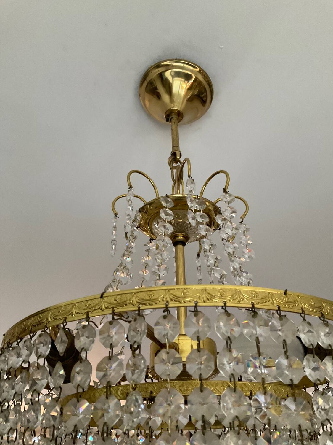 Cascade chandelier with crystal and brass tassels