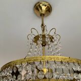 Cascade chandelier with crystal and brass tassels