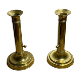 Duo de bougeoirs poussoir en laiton