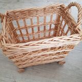 Vintage wicker basket on wheels - children's toy trolley