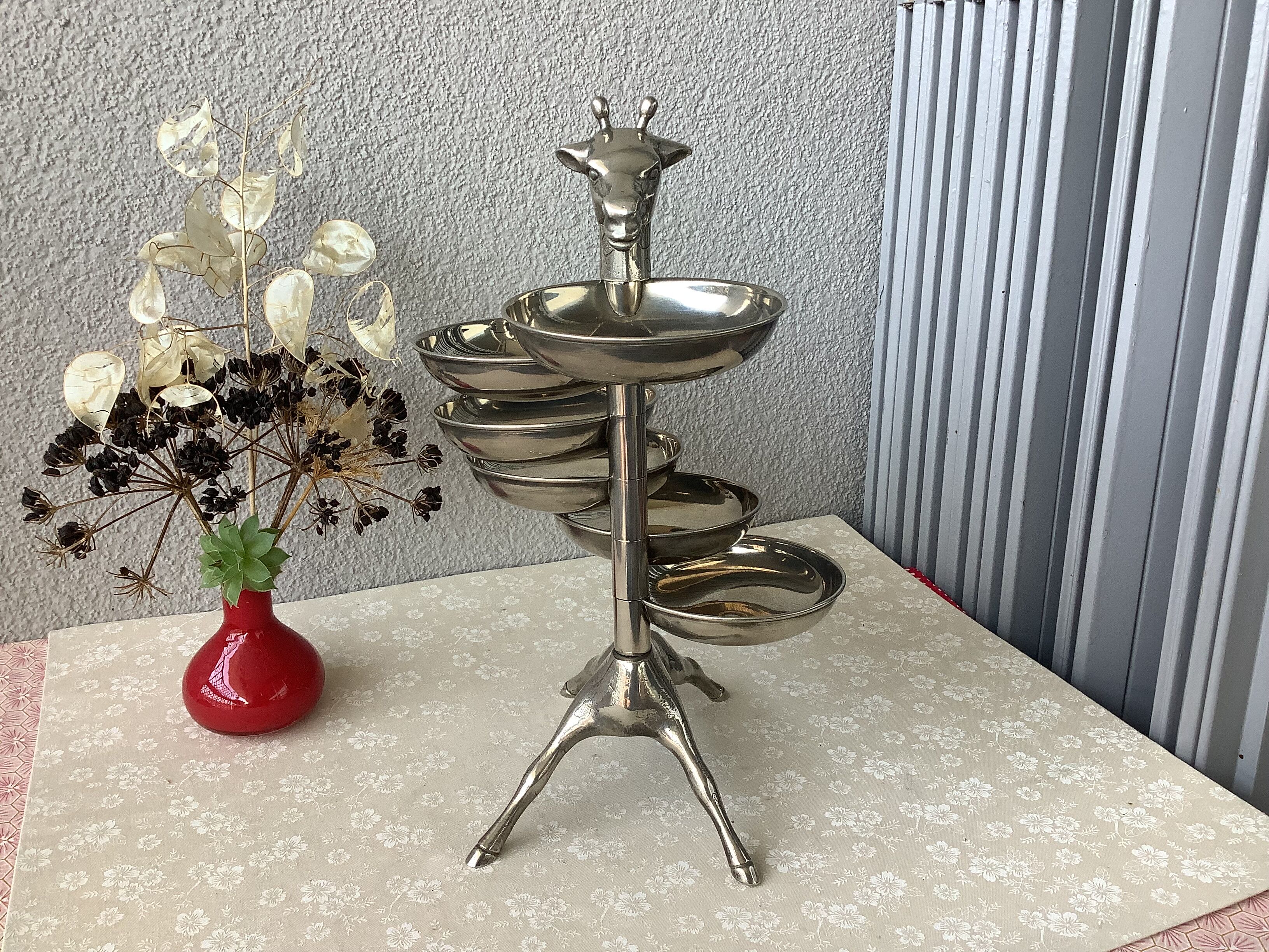 Bronze giraffe and silver metal servant