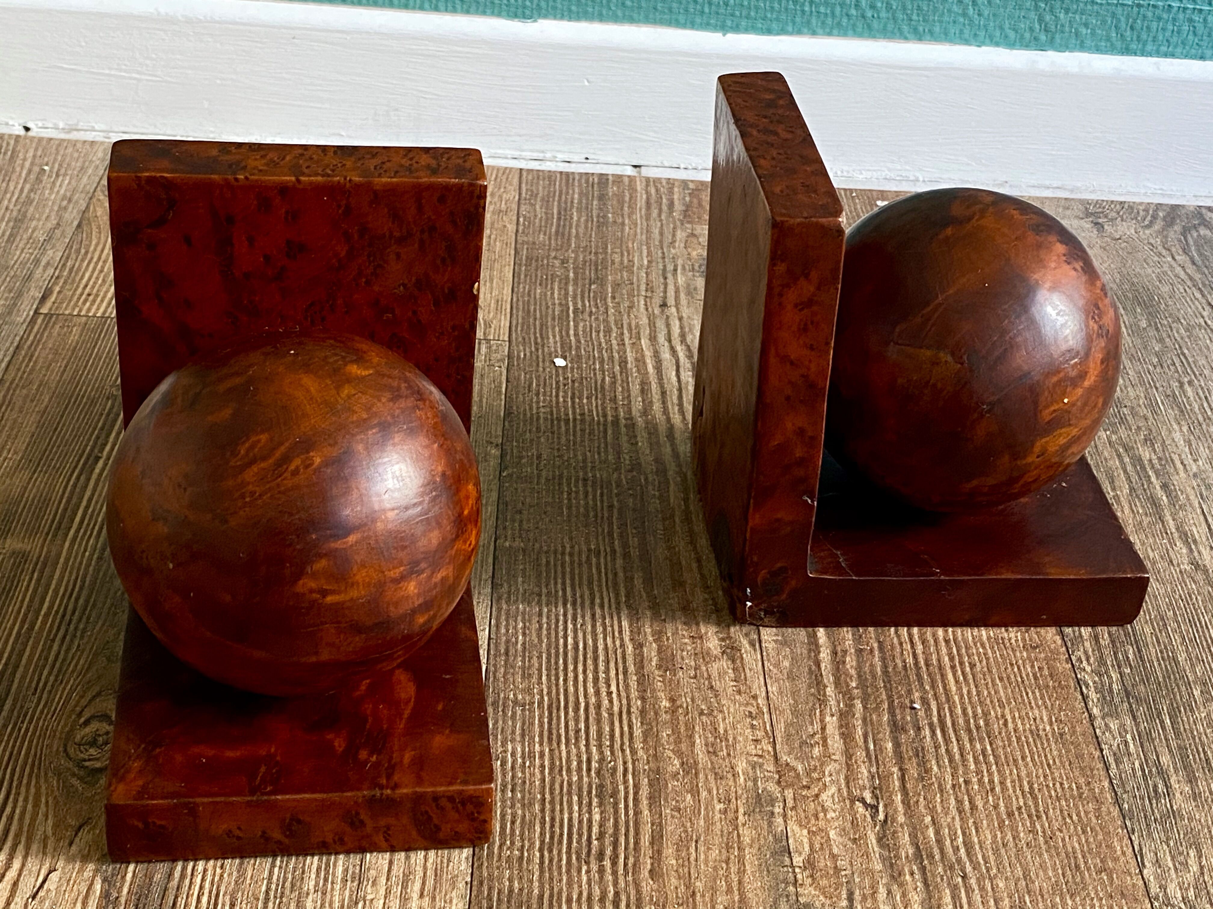 Pair of bookends adorned with spheres