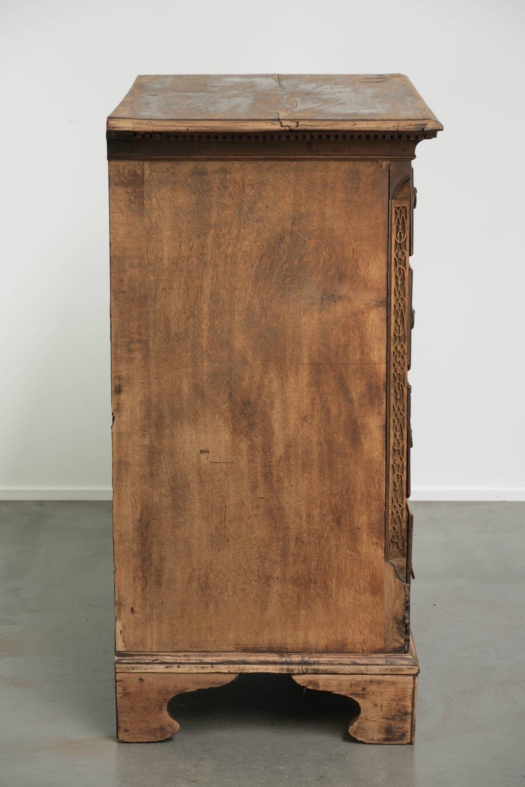 Richly carved English oak chest of drawers from the 18th century