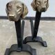 Pair of metal chenets decorated with brass dog heads