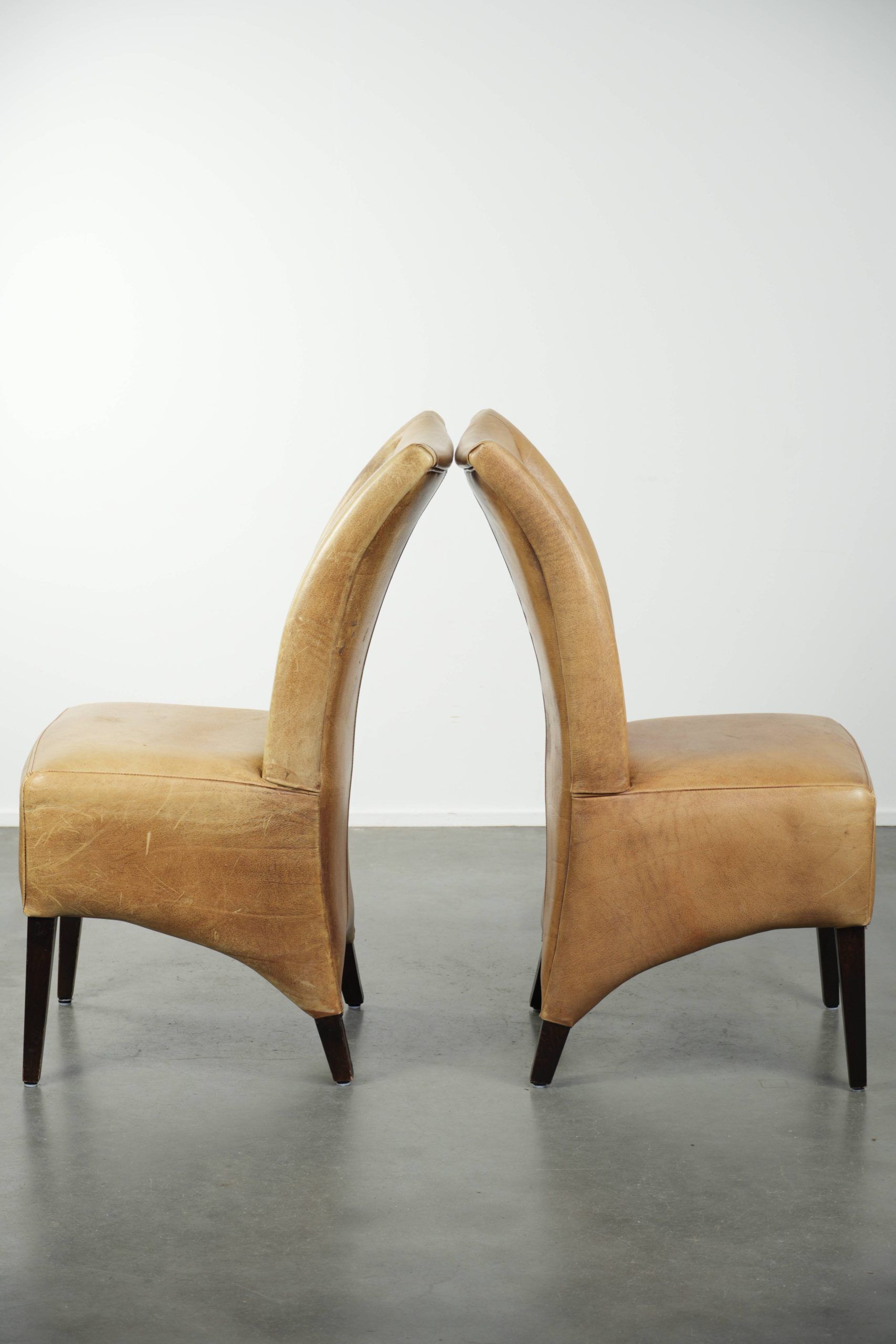 Set of six cowhide dining chairs with a comfortable seat and high back