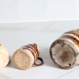 3 old bicoloured enamelled stoneware jugs