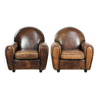 Set of two sheepskin Art Deco design armchairs with beautiful patina