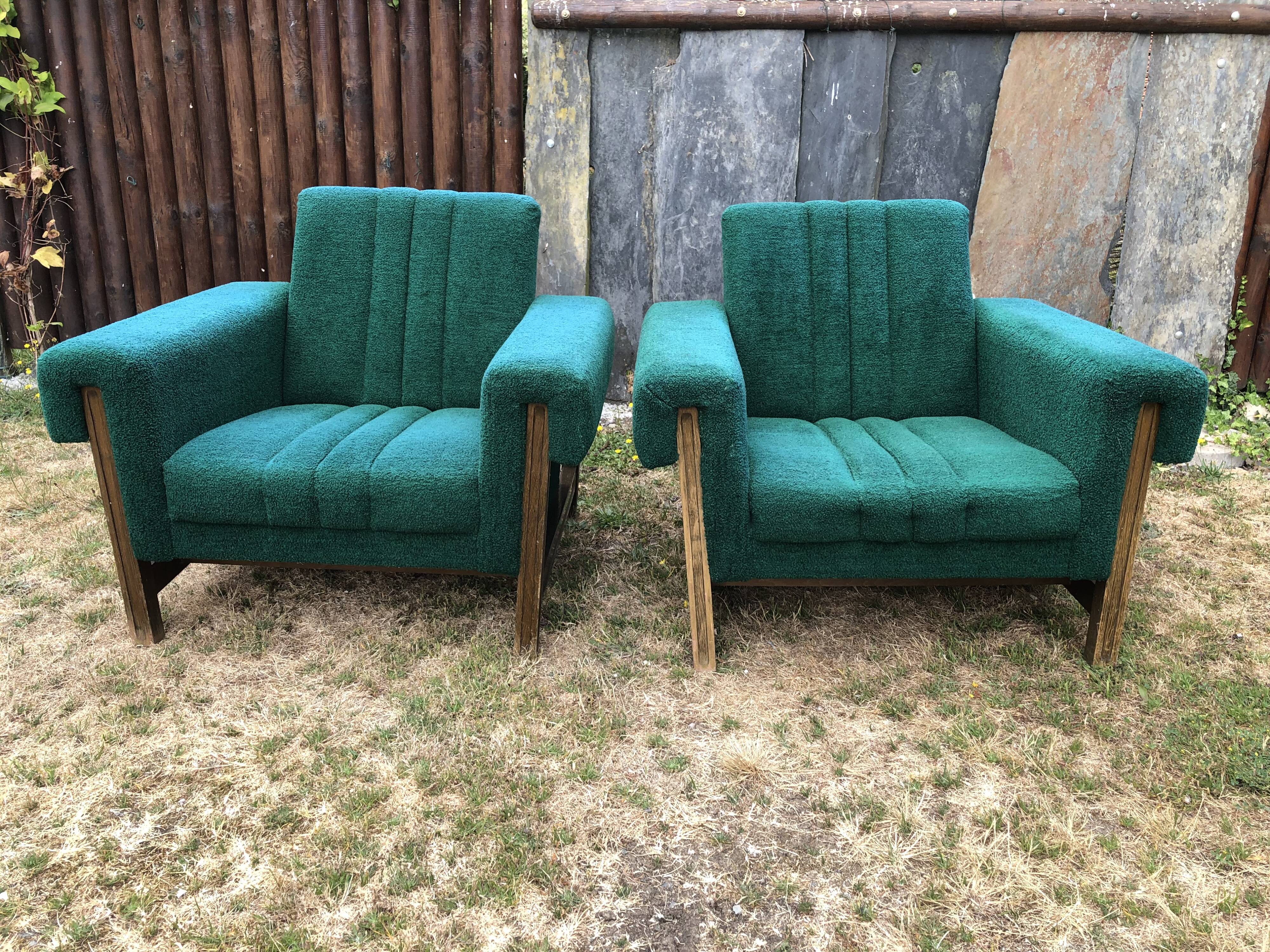 Duo of vintage armchairs with green fabrics.