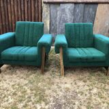 Duo of vintage armchairs with green fabrics.