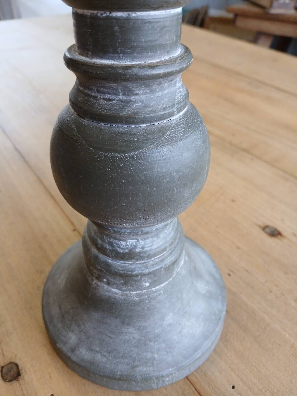 Candle holder in patinated wood