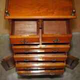 Victorian high chest of drawers in walnut with a bronze gallery.