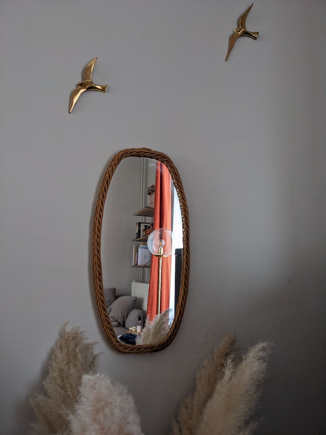 Vintage oval rattan mirror