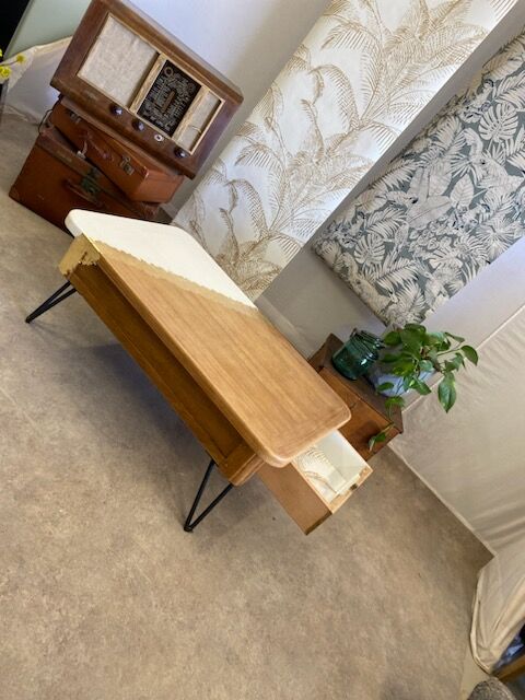 Coffee table with pin legs and gold leaf