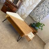 Coffee table with pin legs and gold leaf