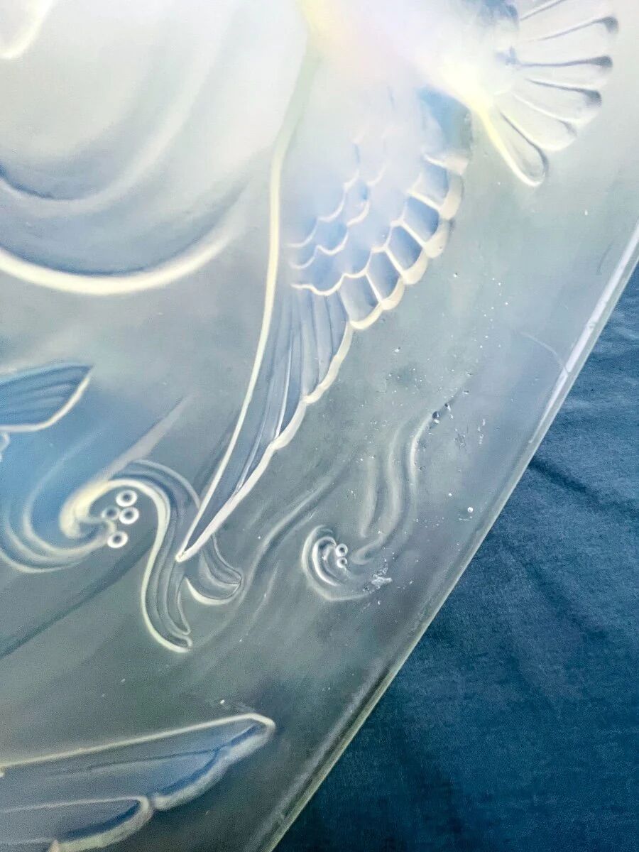 Verlys, iridescent glass cut with a design of geese and fish.