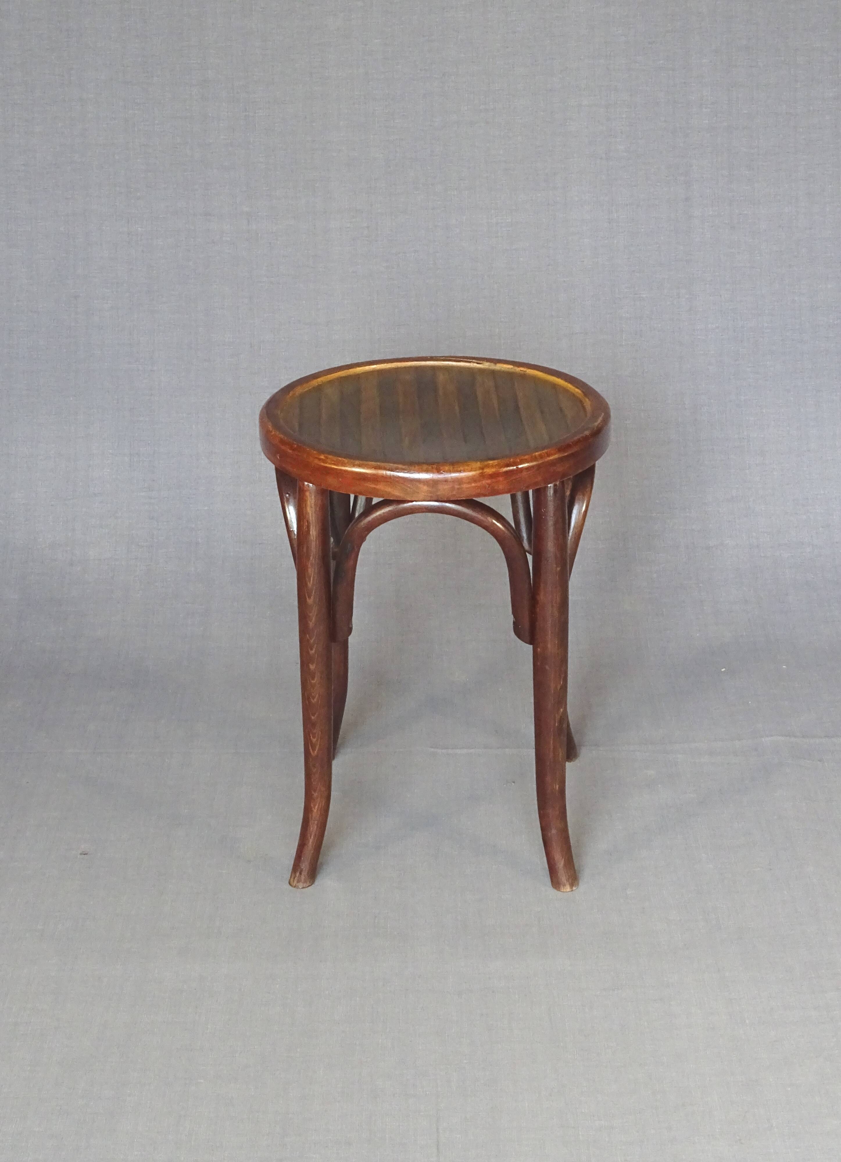 low bistro stool in curved wood laminated seat, circa 1920
