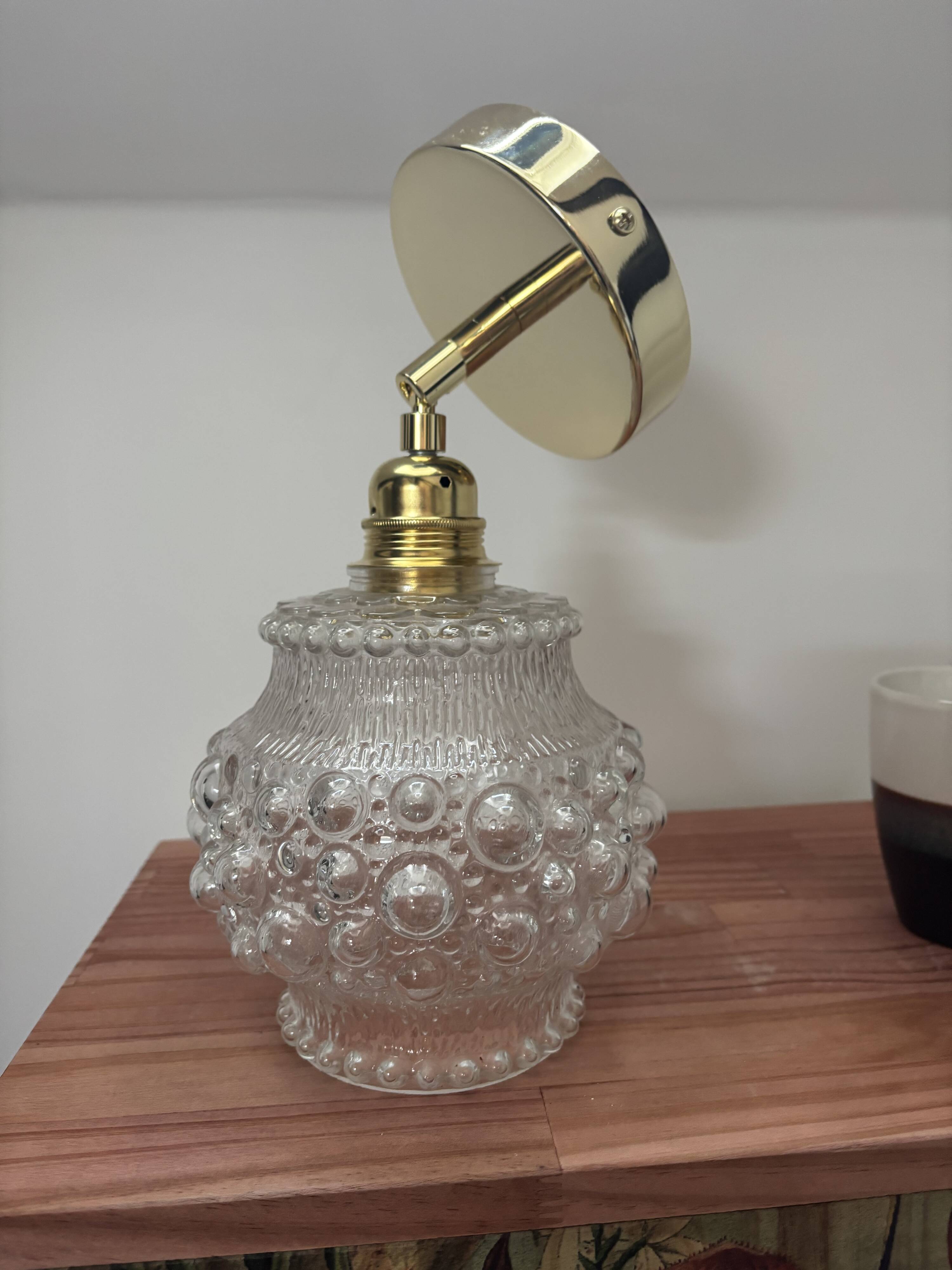 Gold wall light with bubble glass