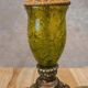 Vintage lamp with bronze imitation base & green relief glass in an antique style.