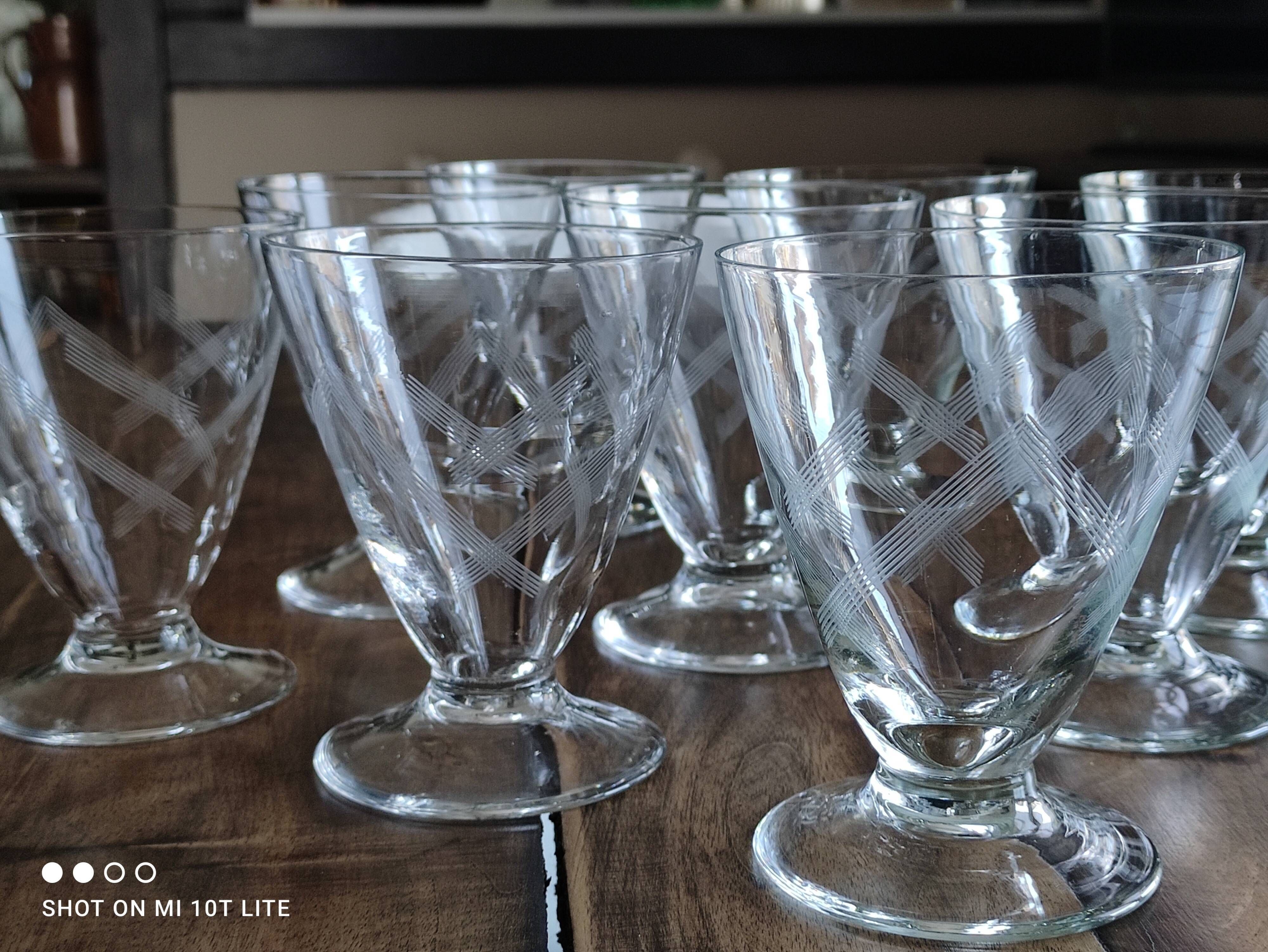 Set of 9 conical glasses on pedestal in antique chiseled glass crosses