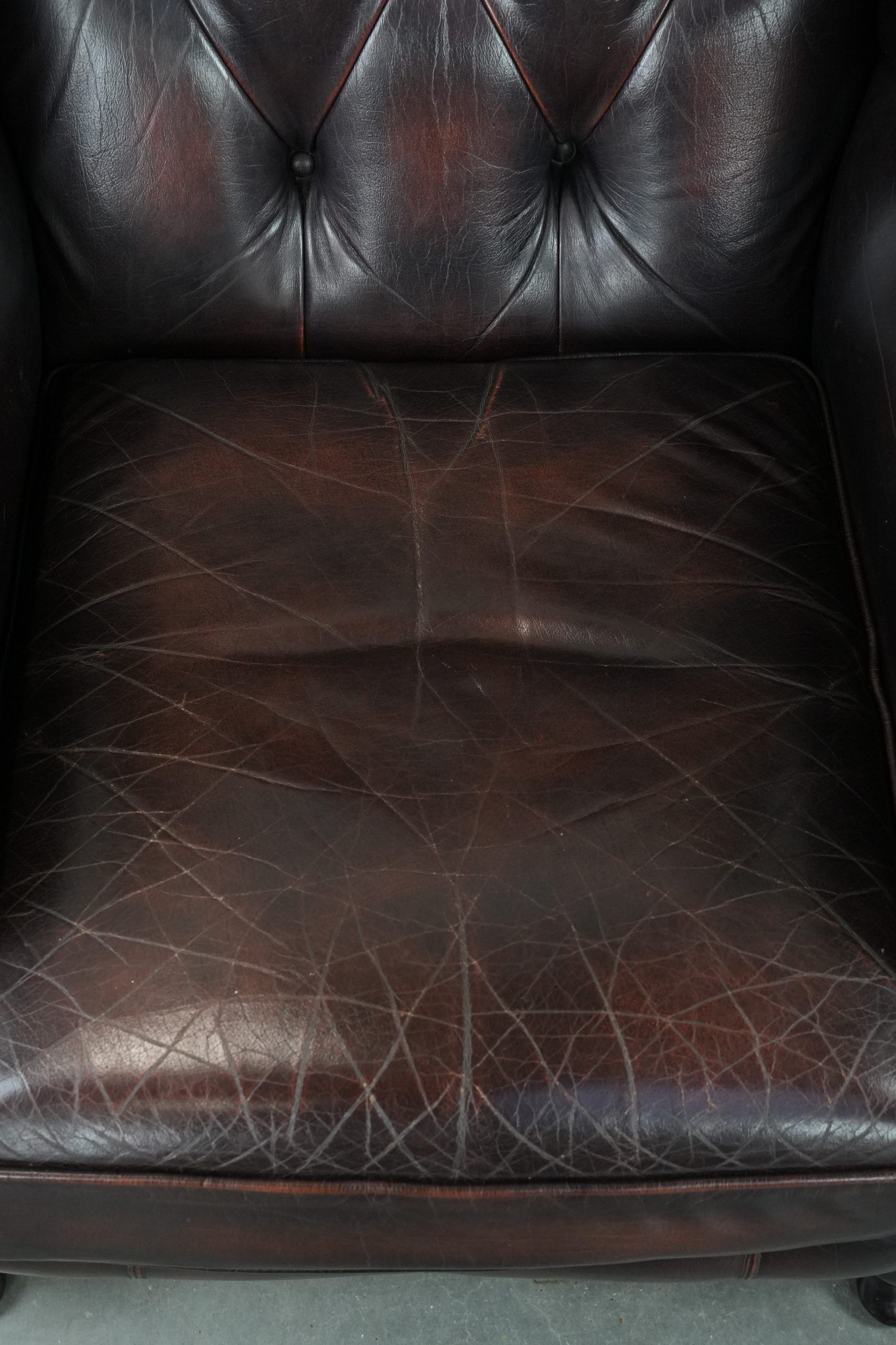 Cowhide leather Chesterfield wingback armchair in classic English style