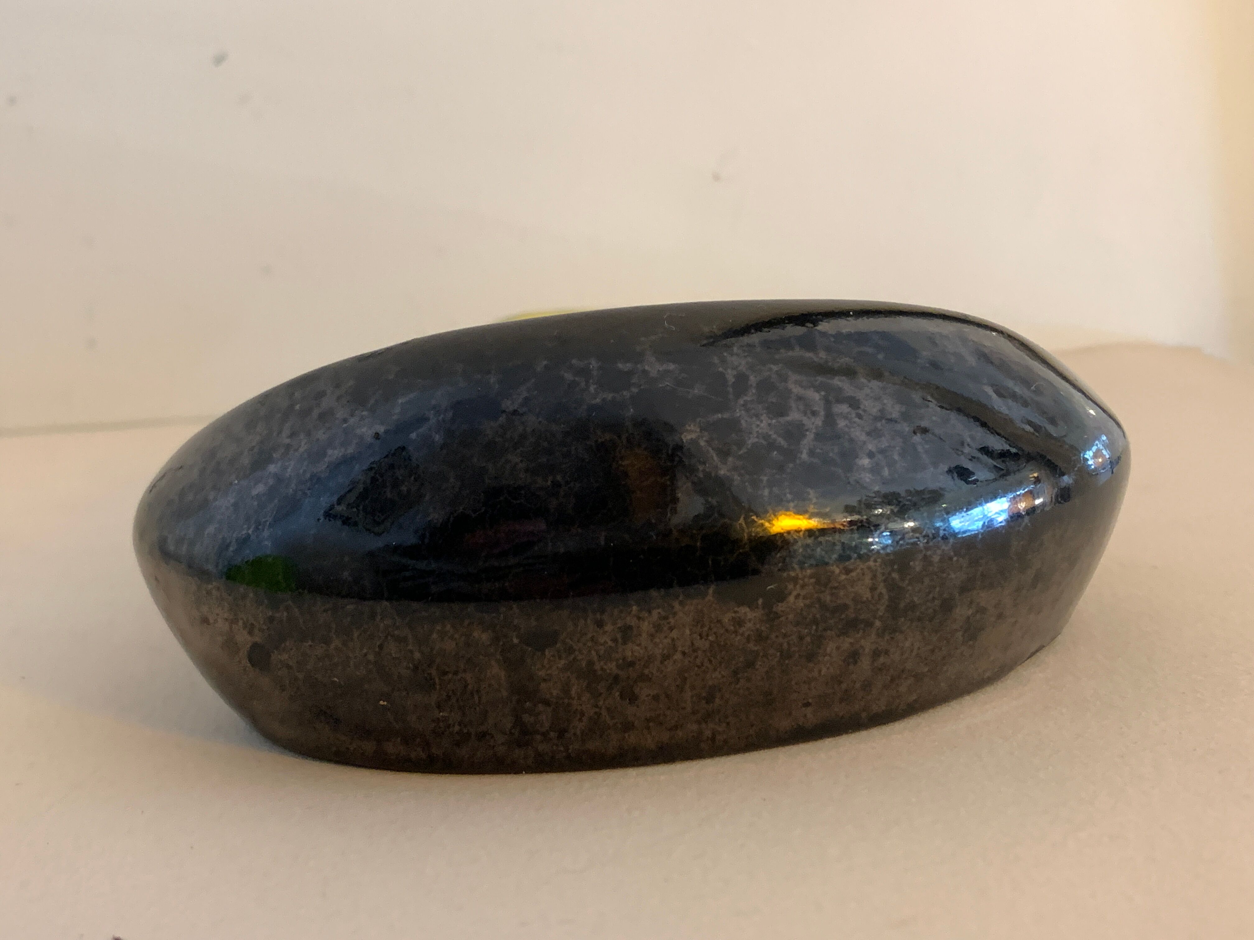 Yellow and black ceramic ashtray