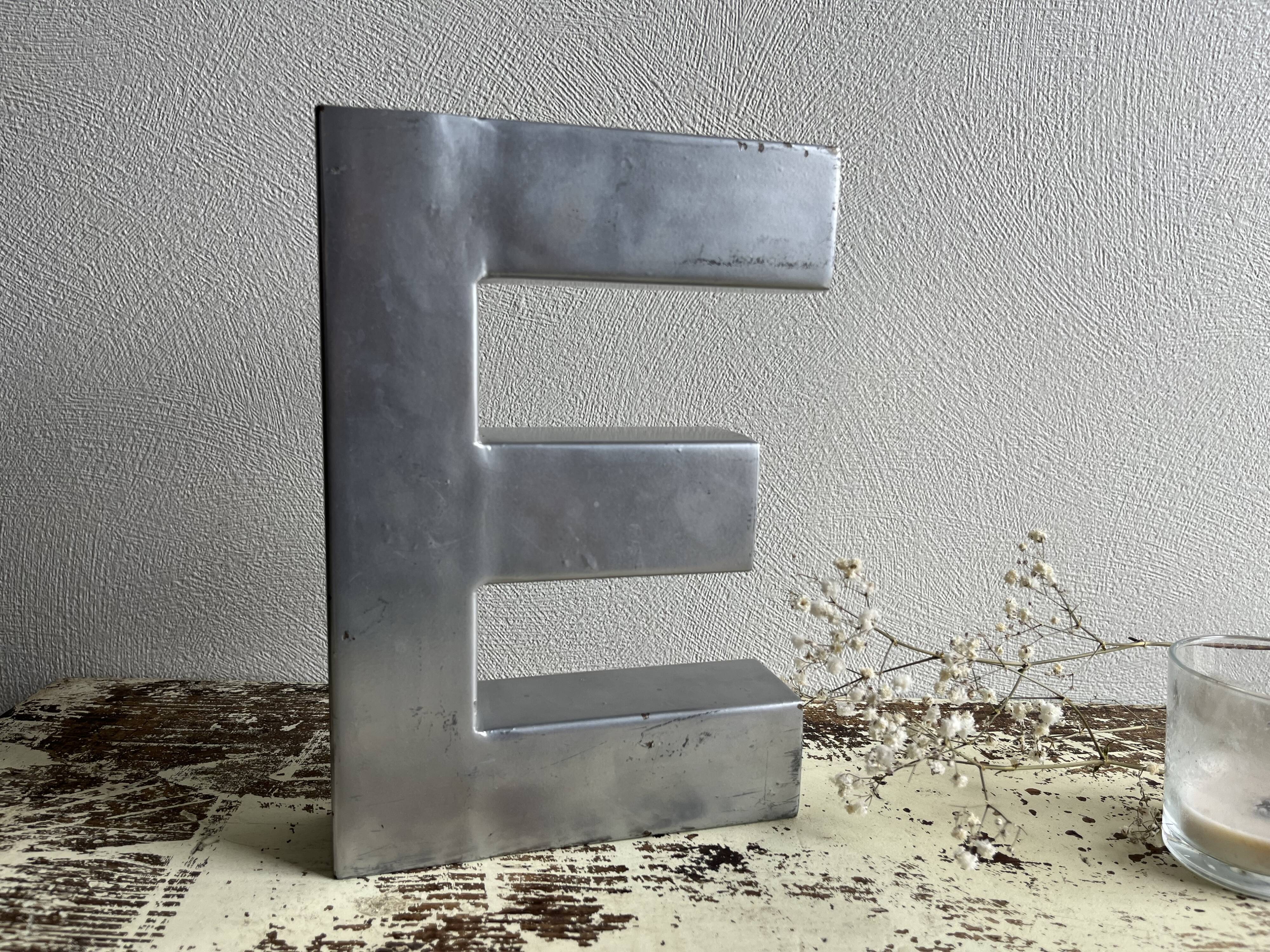 Metal sign letter E