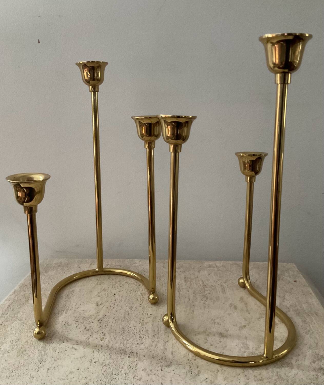 Duo of modernist brass candlesticks