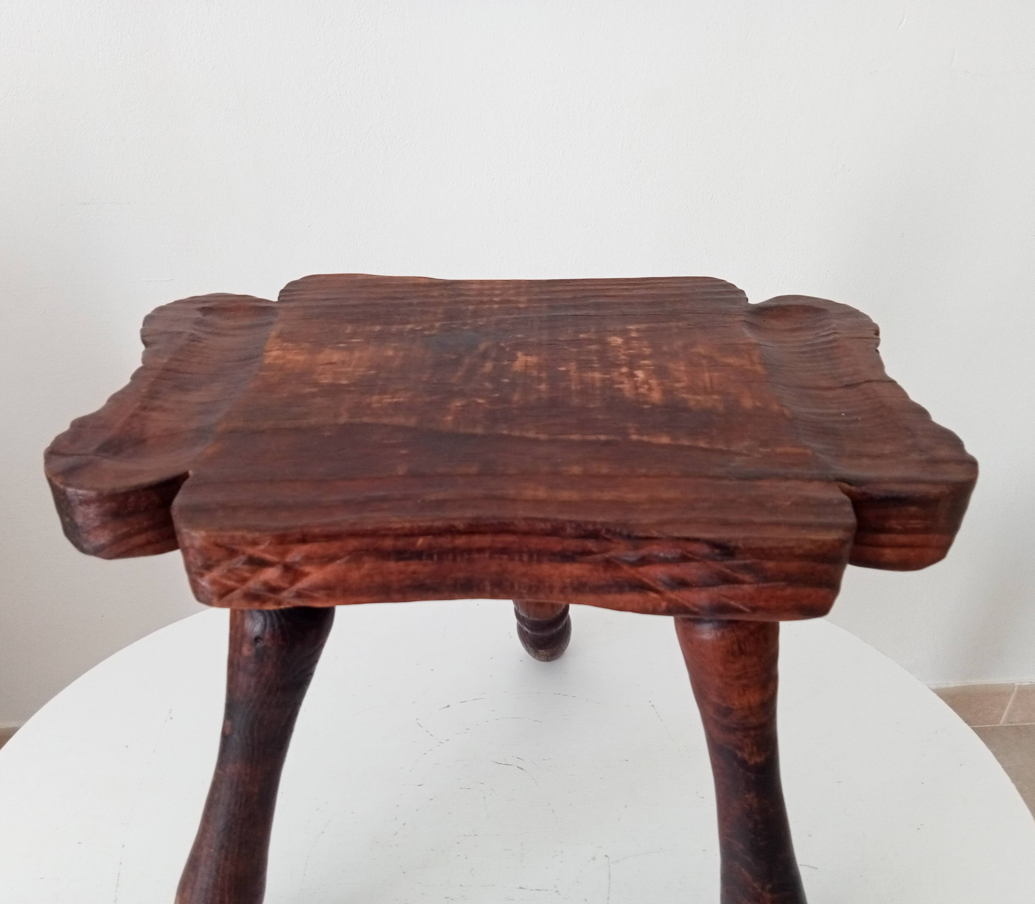 Brutalist Spanish tripod stool in solid carved wood.