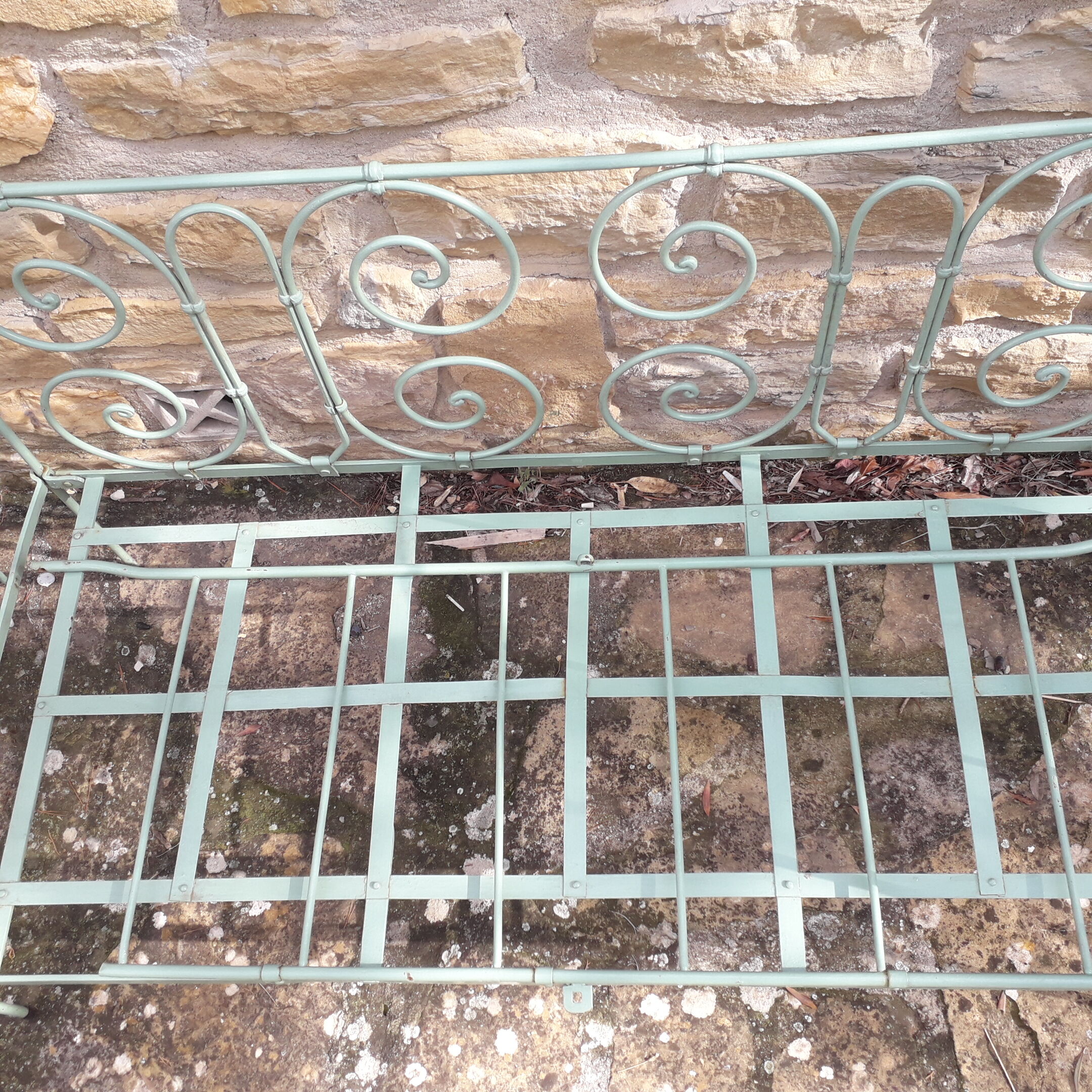 Former child bed in wrought iron