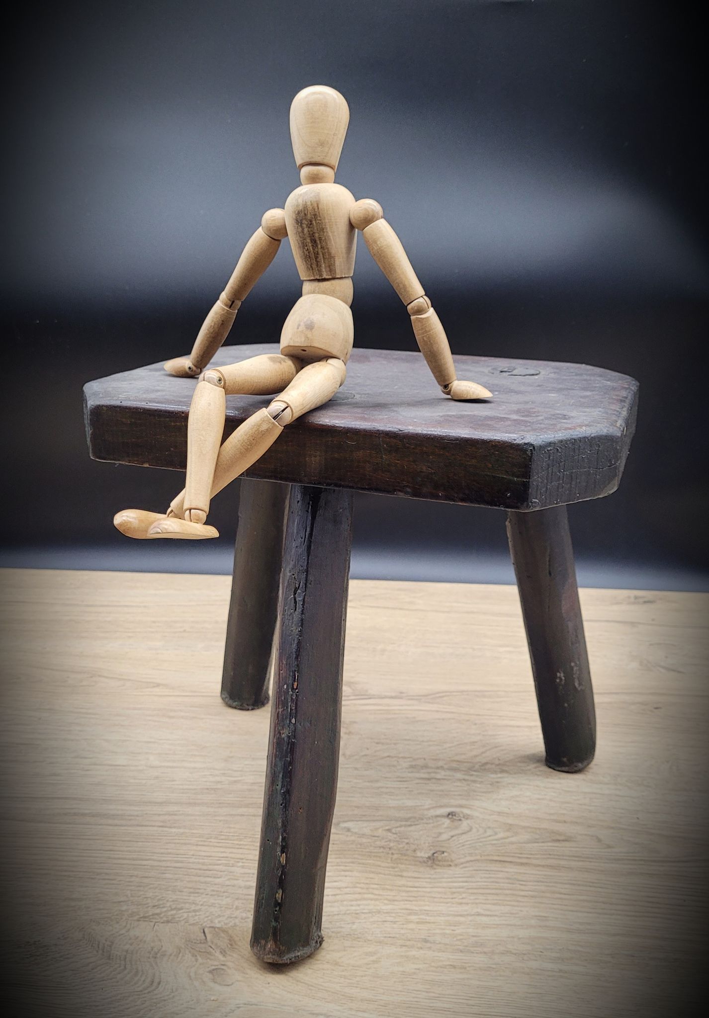 Dark octagon tripod stool