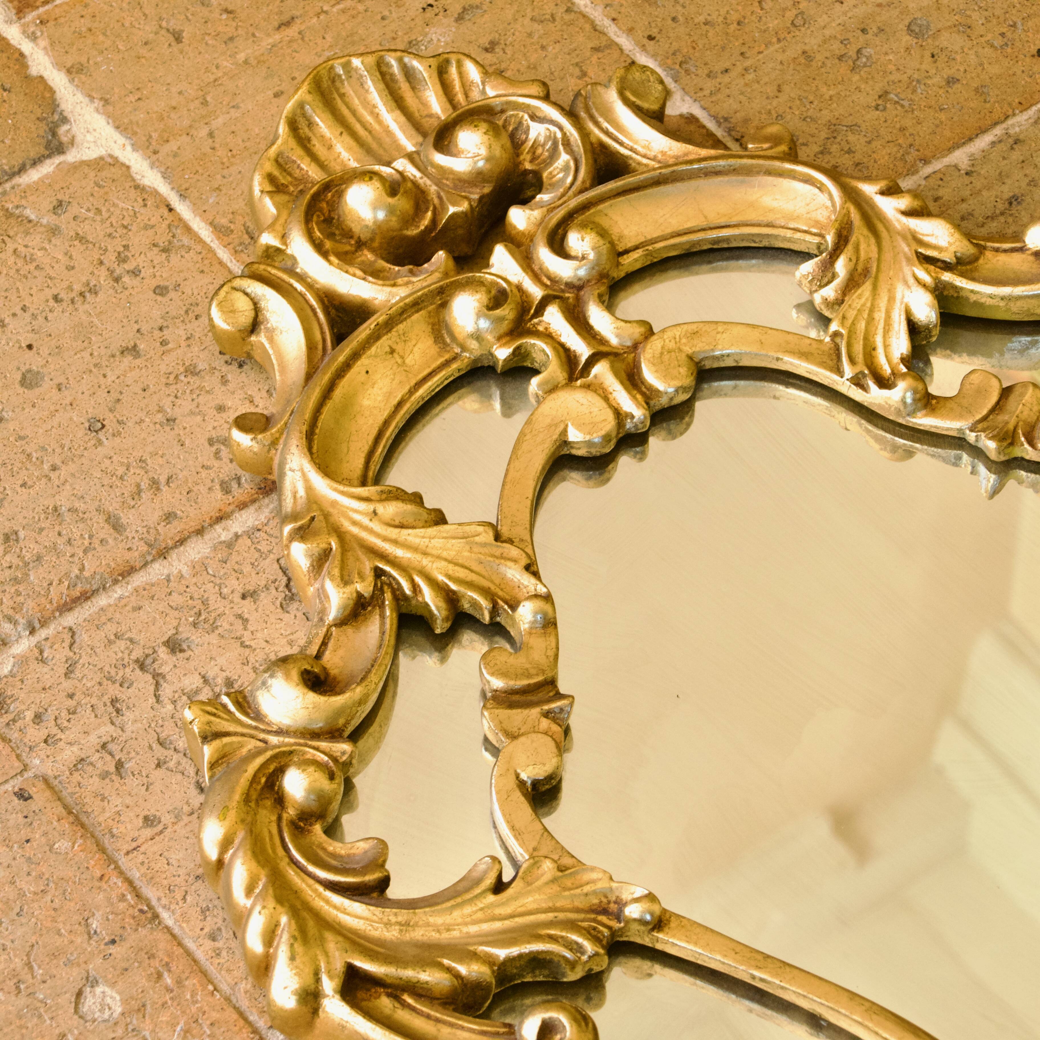 Antique Baroque mirror with gilded metal panels