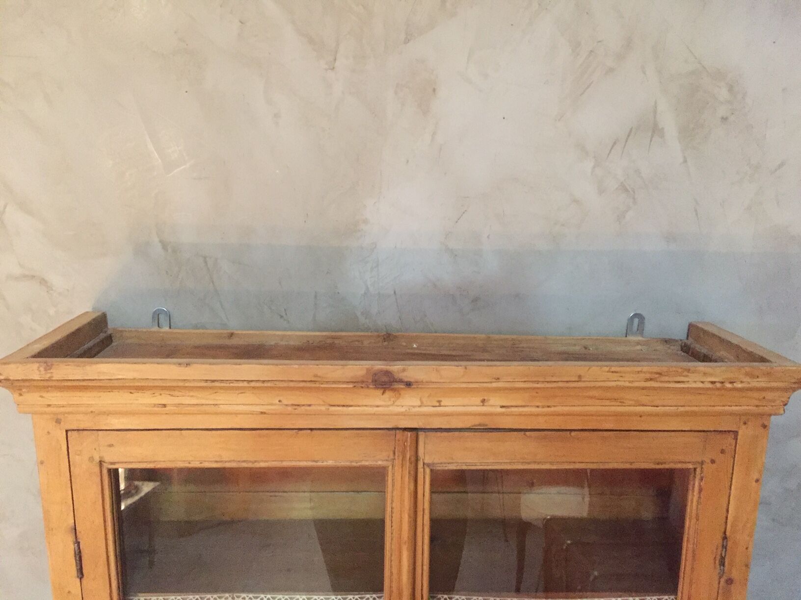 Suspended in early twentieth century tree window