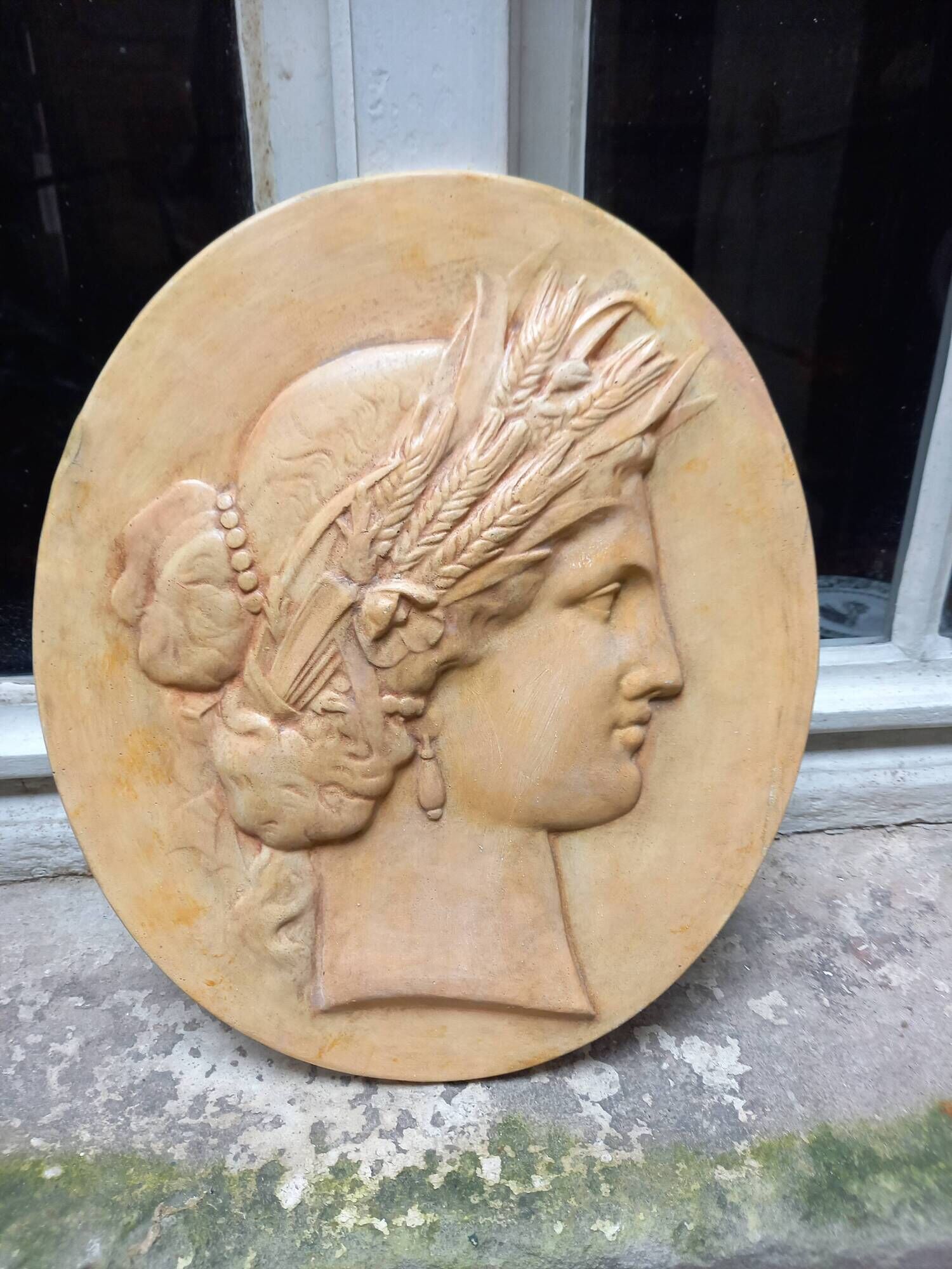 Plaster medallion, high relief, yellow ochre patina, representing the Roman divinity Ceres