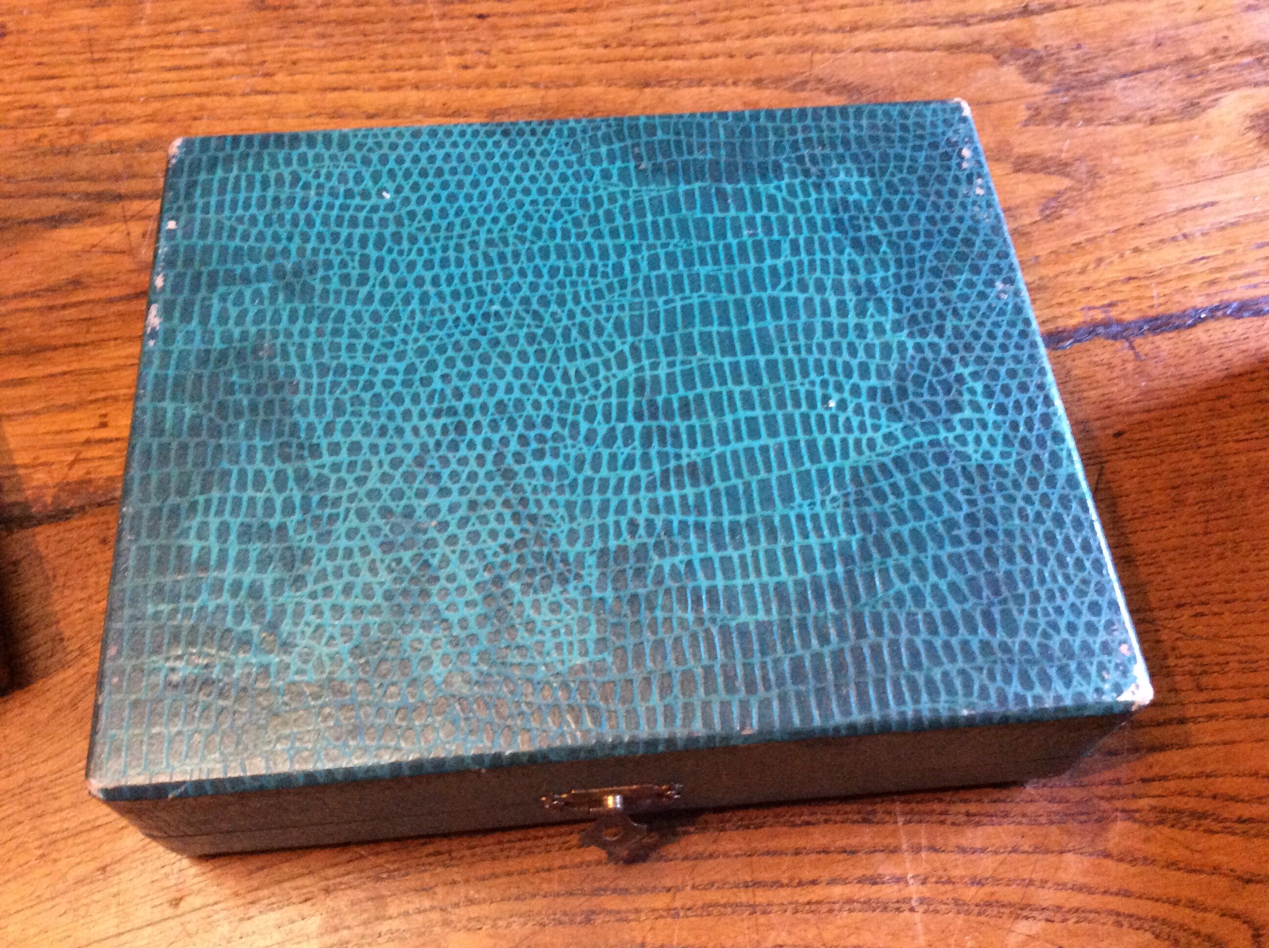 12 small art deco spoons, silver metal